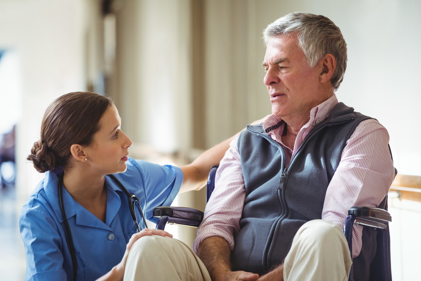 29233292_nurse-taking-care-of-sad-senior-man