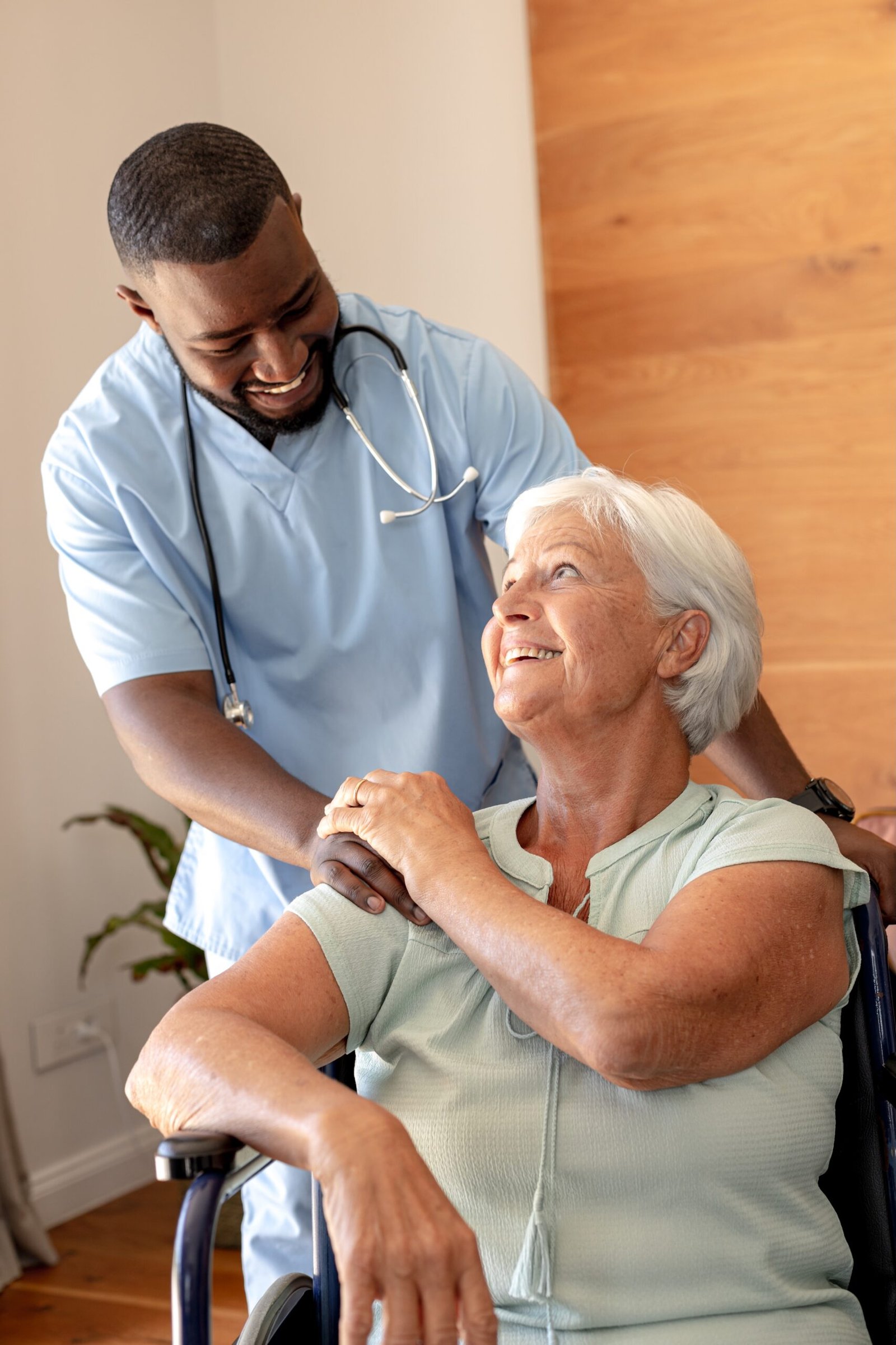 friendly-caregiver-with-senior-woman-smiling-toget-2026-03-25-01-26-10-utc